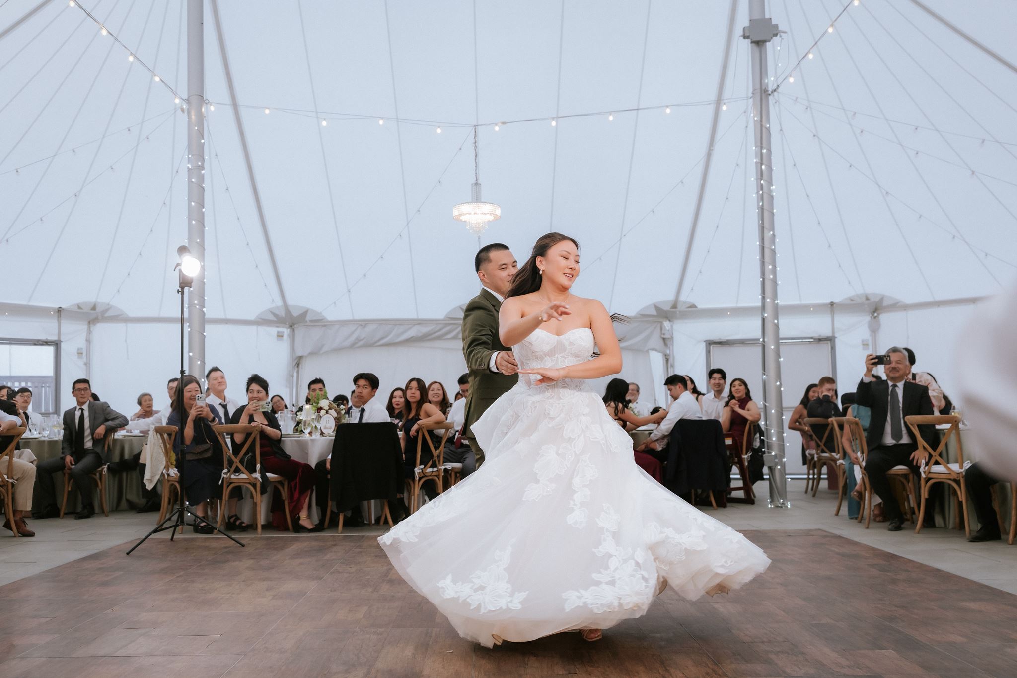 Newlyweds sharing their first dance at Nella Terra Cellars in Sunol