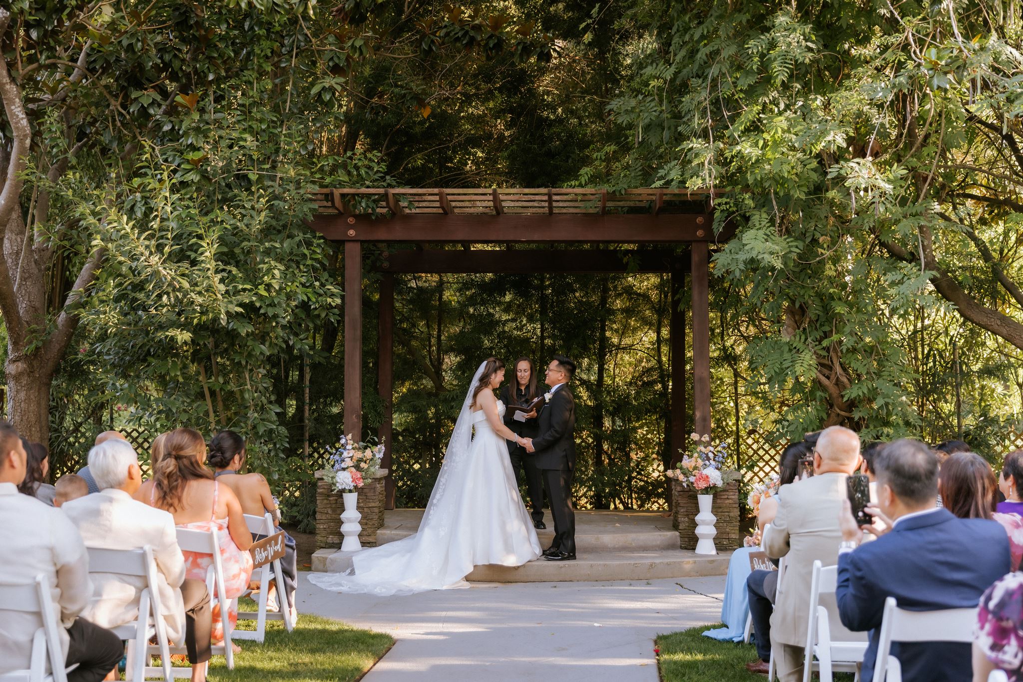 Outdoor wedding ceremony surrounded by trees at Redwood Canyon in Castro Valley