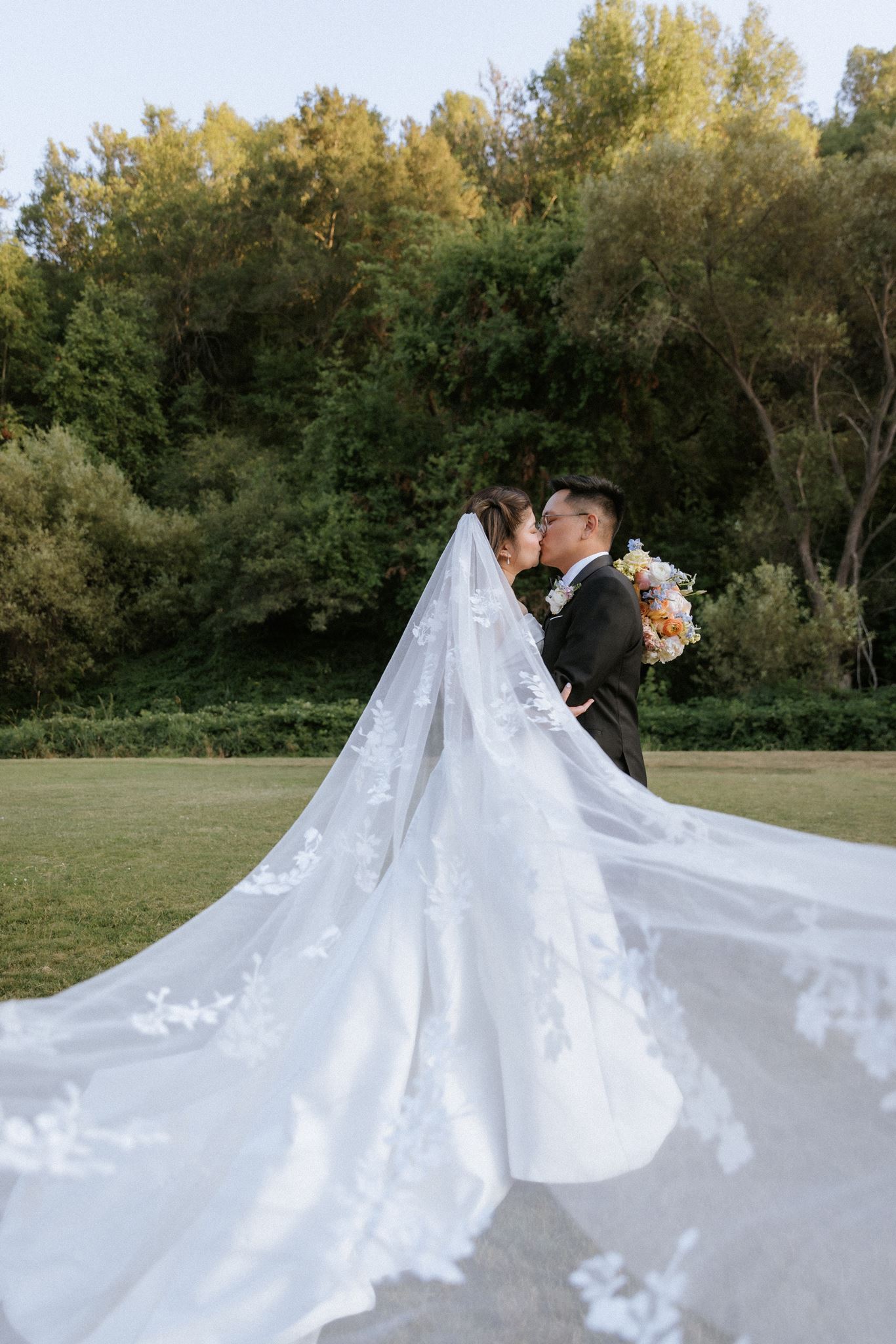 Outdoor wedding ceremony surrounded by trees at Redwood Canyon in Castro Valley