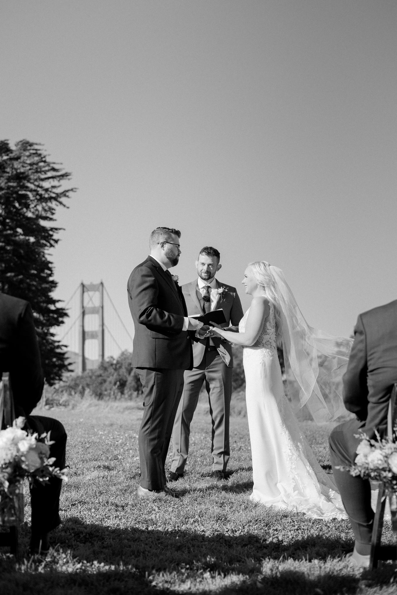 Couple exchanging vows during their Log Cabin Presidio wedding ceremony