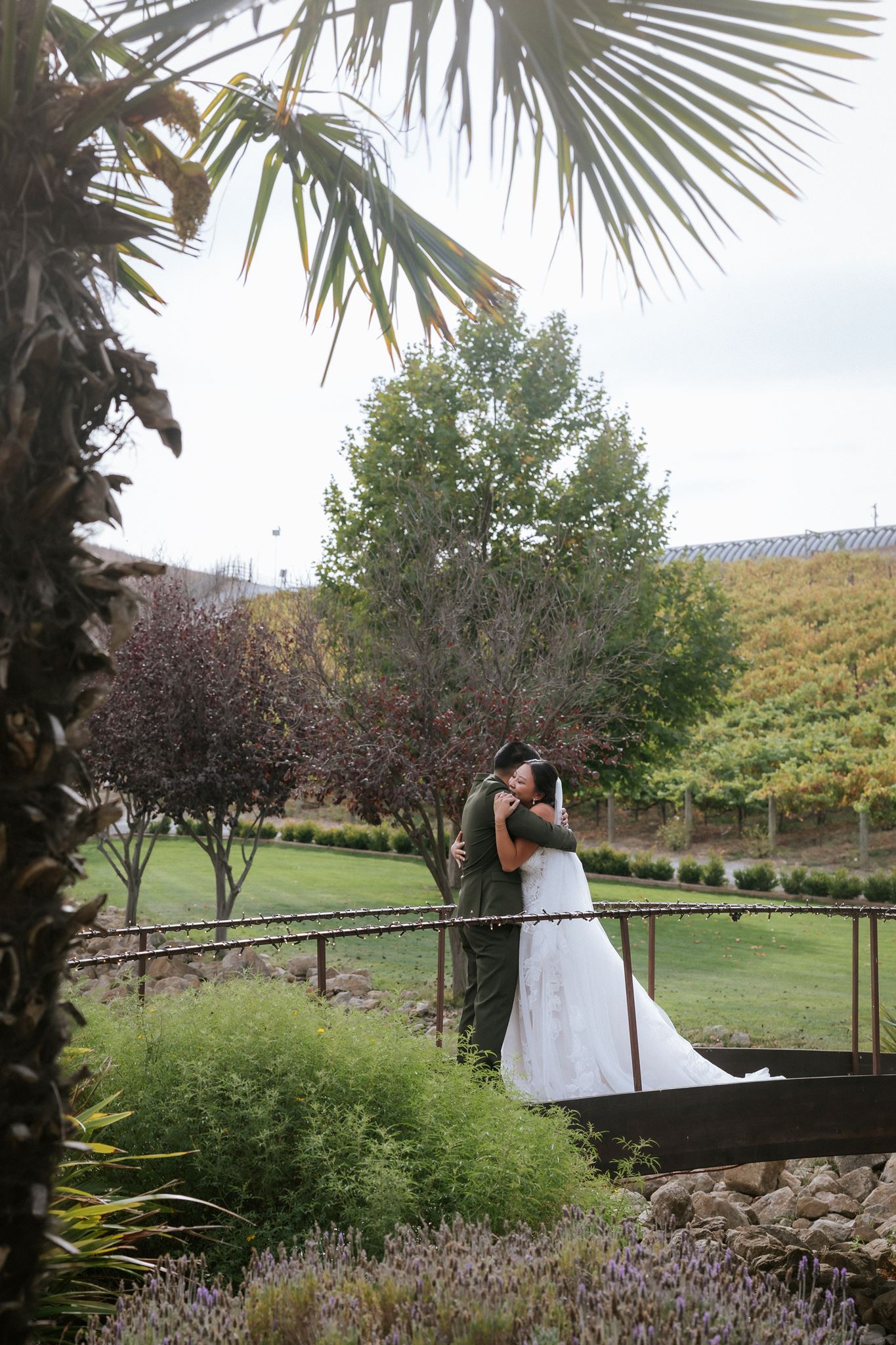 Couple embarcing after their first look on the bridge at Nella Terra