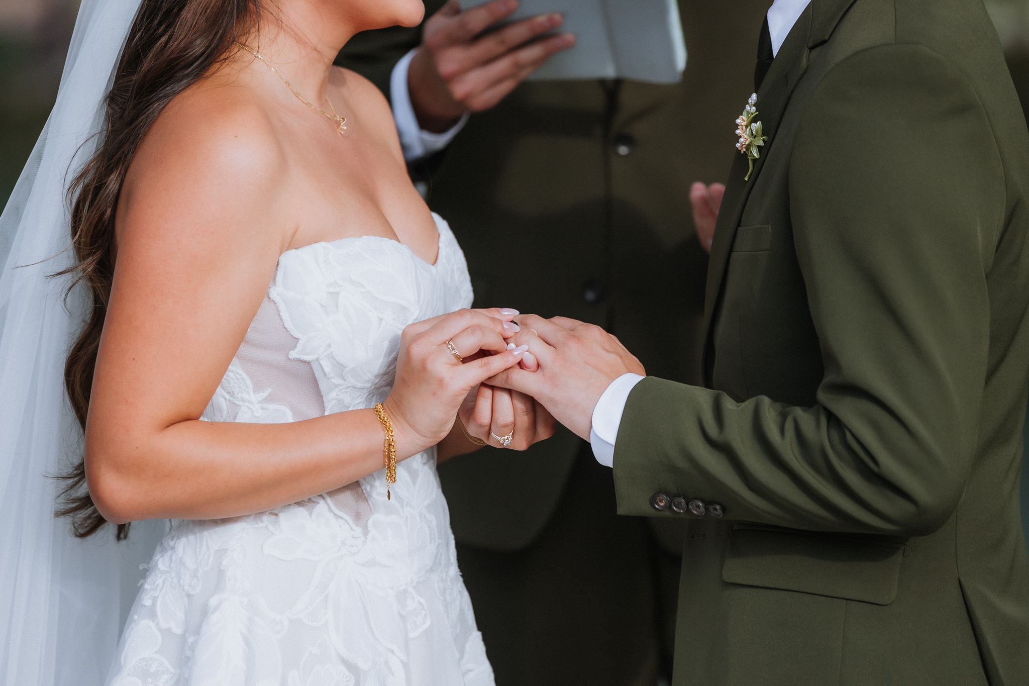 Couple ring exchange during Ceremony at Nella Terra