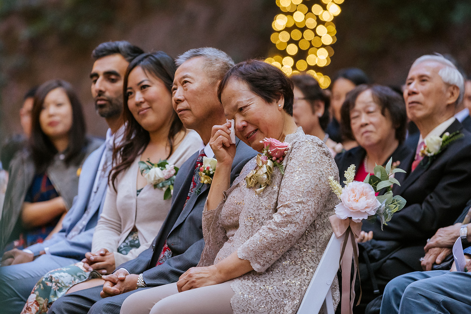 Family and guests watching a wedding ceremony at Saratoga Springs