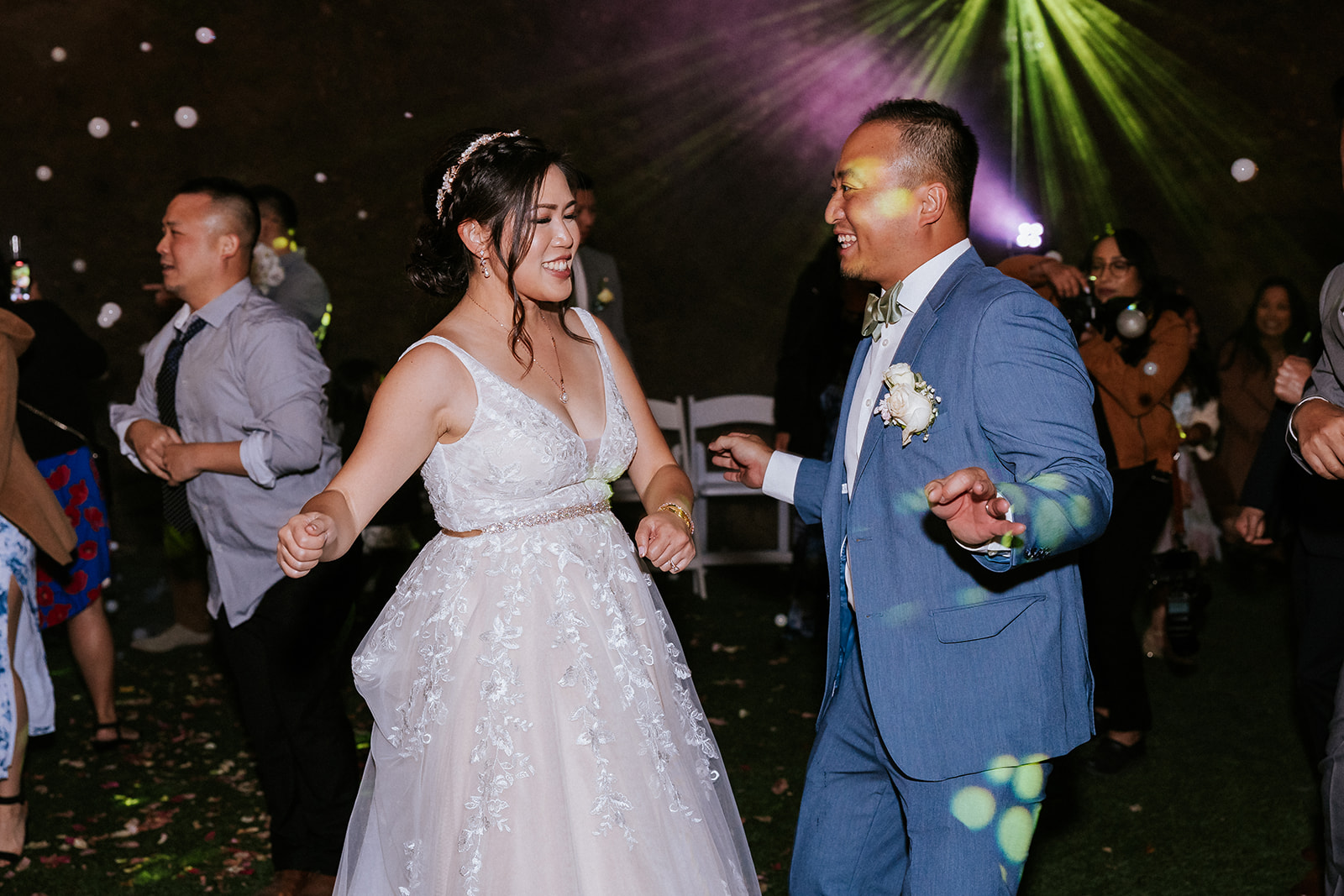 Newlyweds dancing with guests during their Saratoga Springs wedding reception
