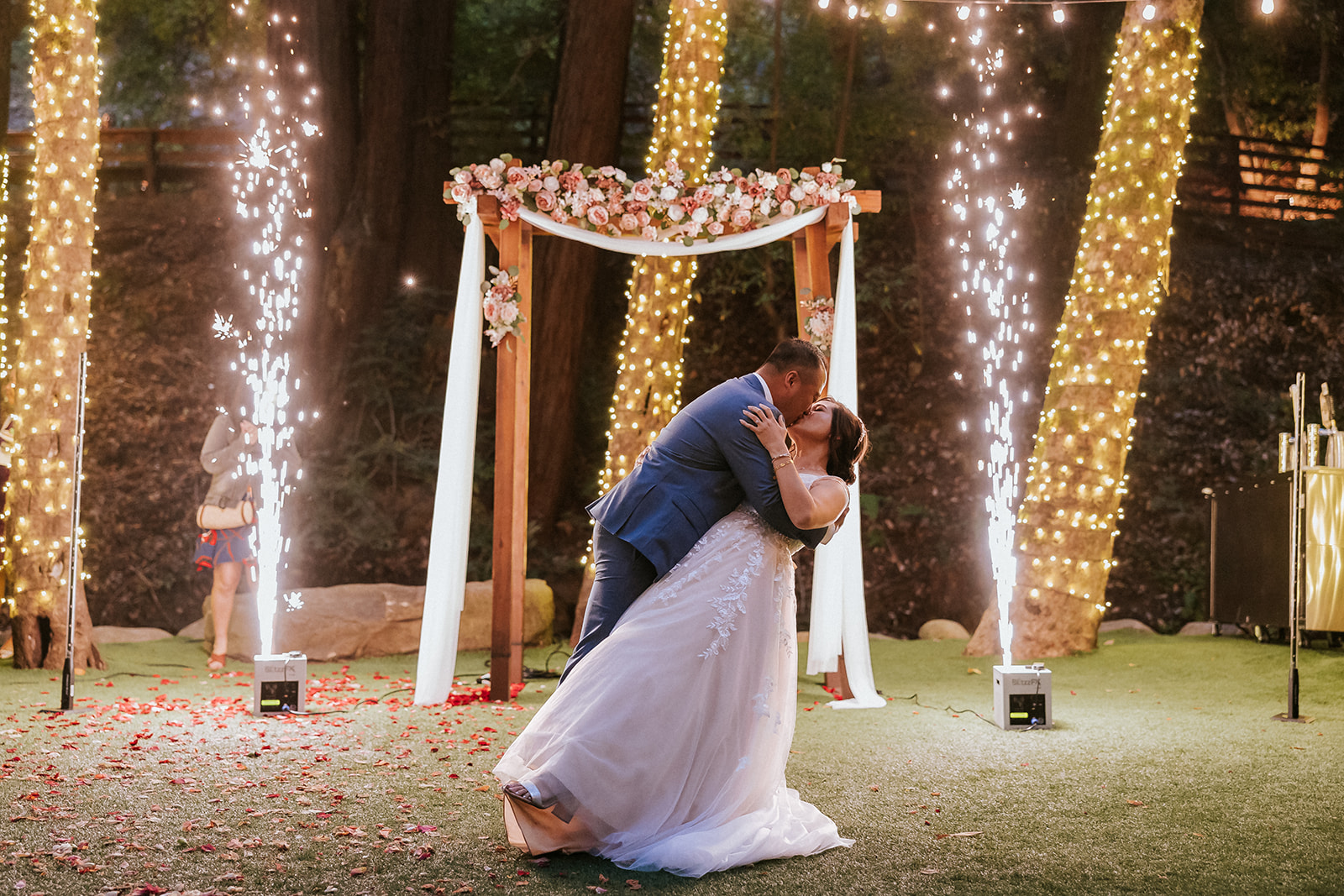 Newlyweds sharing their first dance with sparklers at Saratoga Springs